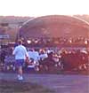 picture of an outdoor concert and a band shell